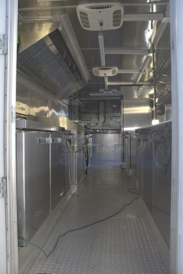 NEW 24' Cruising Kitchens food trailer, stainless steel interior, rooftop A/C, propane and water hookups, security cameras.