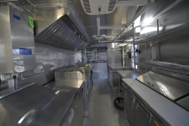 NEW 24' Cruising Kitchens food trailer, stainless steel interior, includes rooftop A/C units, security cameras, propane tanks.