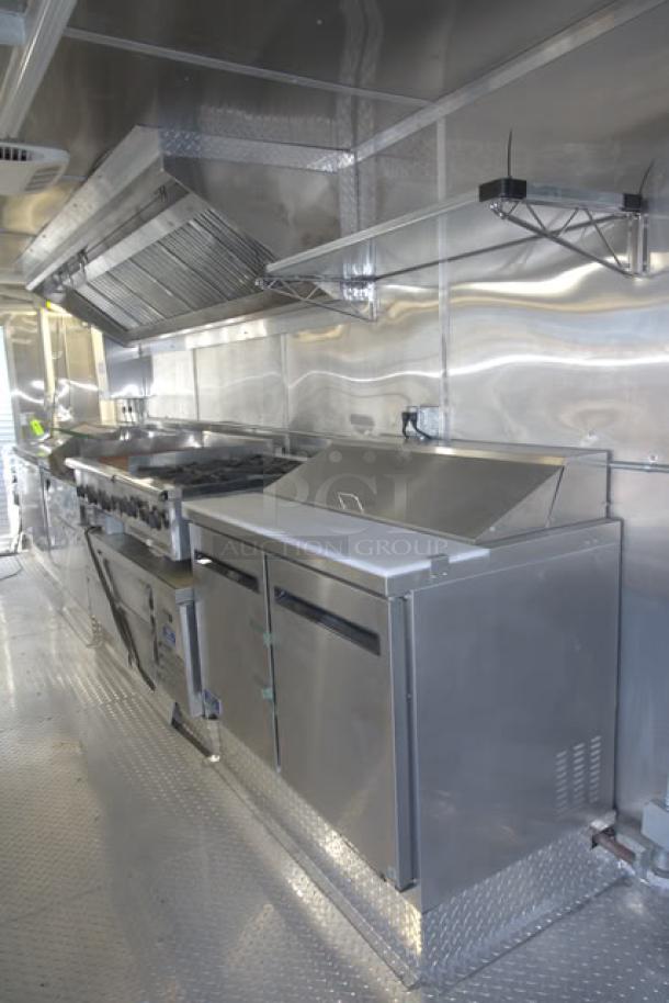 NEW 24' Cruising Kitchens food trailer with top-tier, unused equipment, stainless steel interior, security cameras, and more.