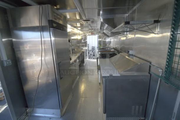 BRAND NEW 2023 Cruising Kitchens 24 Ft. Enterprise Food Trailer, featuring stainless interior, commercial appliances, hood system.