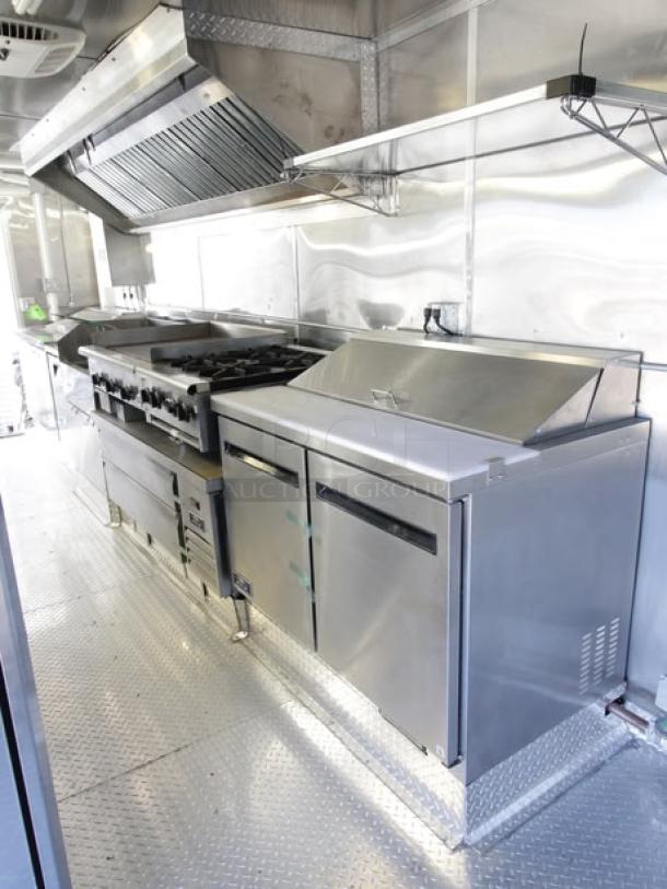 Brand new 2023 Enterprise Food Trailer, featuring commercial-grade appliances, 12ft hood, deep fryers, and state-of-the-art technology.