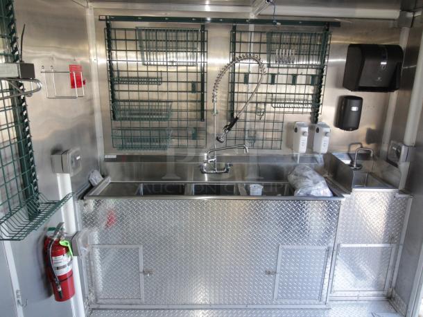 Brand new 2023 24 ft. Cruising Kitchens mobile kitchen, stainless steel interior, dual sinks, safety systems, and equipment.