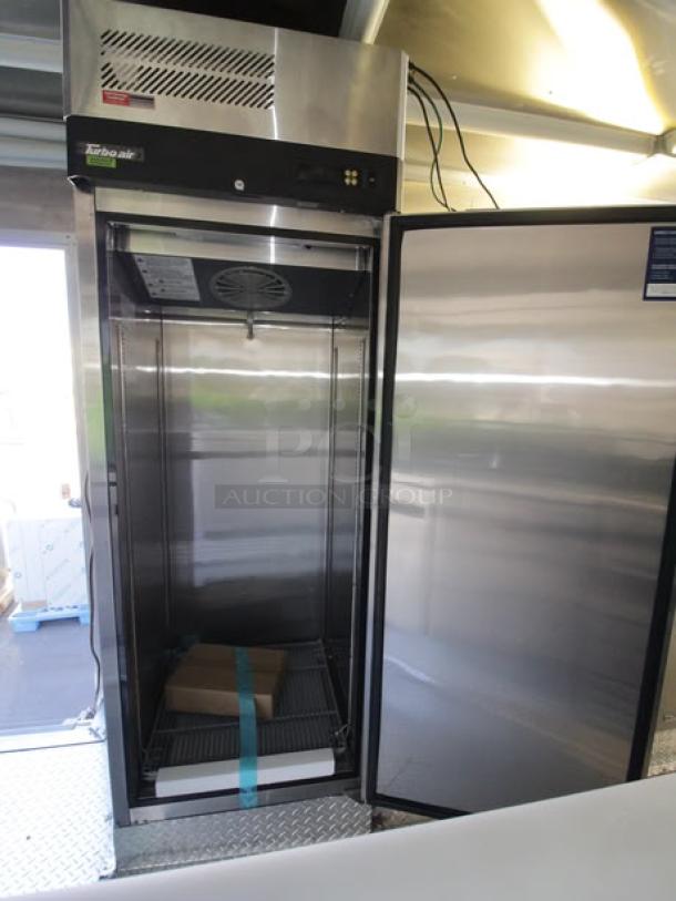 2023 Cruising Kitchens 24 Ft. Enterprise Food Trailer interior with stainless steel commercial cooler.