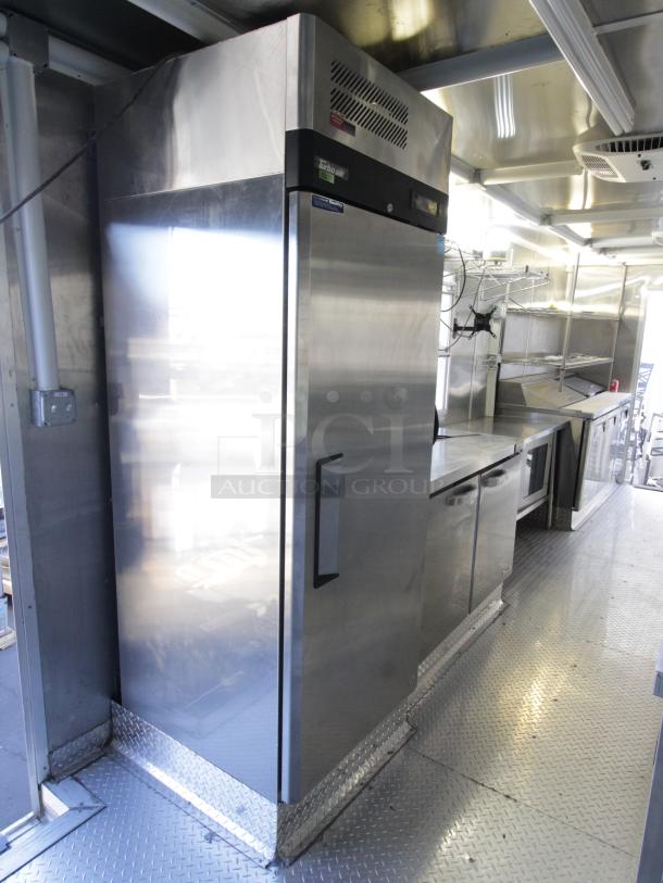 Brand new 2023 Cruising Kitchens 24 ft. Enterprise food trailer, stainless steel interior with commercial appliances.