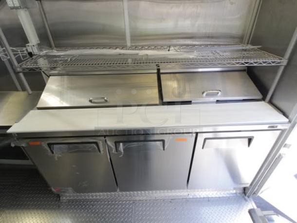 Brand new 2023 Cruising Kitchens 24 ft. mobile kitchen with commercial-grade appliances, stainless steel counters, and coolers.