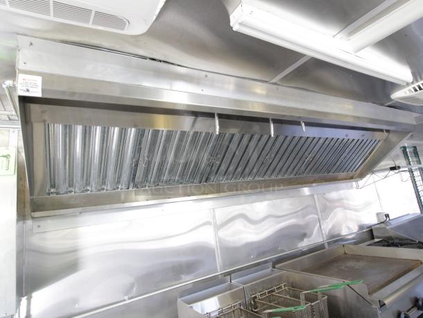 Cruising Kitchens 24 ft. Enterprise mobile kitchen with 12ft hood, ANSUL system, griddle, deep fryers, and range.