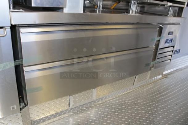 Brand new 2023 Cruising Kitchens 24 Ft. Enterprise food trailer interior with commercial-grade appliances and stainless steel finish.