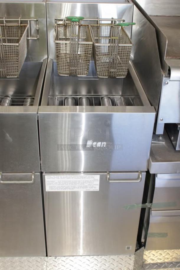 Dean brand stainless steel deep fryer in a new 2023 Cruising Kitchens mobile kitchen trailer, showing commercial-grade basket setup.