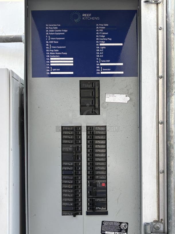 Electrical panel for 2023 Cruising Kitchens 24 ft. Enterprise Food Trailer. Features labeled breakers for appliances and systems.