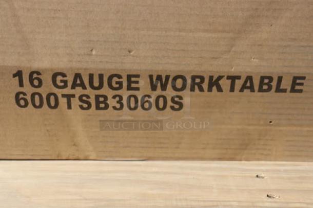 Regency 600TSB3060S 30" x 60" stainless steel work table, 16-gauge, 4" backsplash, undershelf, slight scratching/denting.