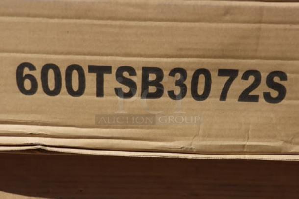 BRAND NEW Regency 600TSB3072S stainless steel work table with backsplash and undershelf, in box, model number displayed.