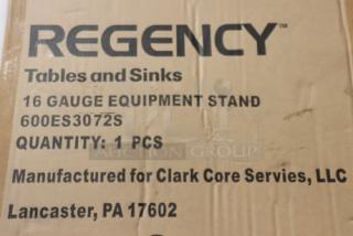 Cardboard box with label for Regency 600ES3072S 16-gauge stainless steel equipment stand; box shows minor damage.