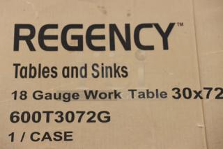 Regency 600T3072G 30"x72" 18-gauge stainless steel work table in original packaging, scratch-n-dent condition.
