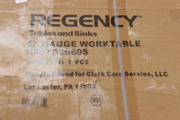 Cardboard box labeled with "Regency 600TS3660S 16 Gauge Worktable," indicating a commercial stainless steel table.