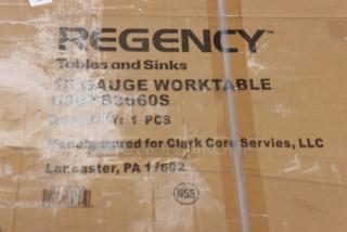 Cardboard box labeled with "Regency 600TS3660S 16 Gauge Worktable," indicating a commercial stainless steel table.