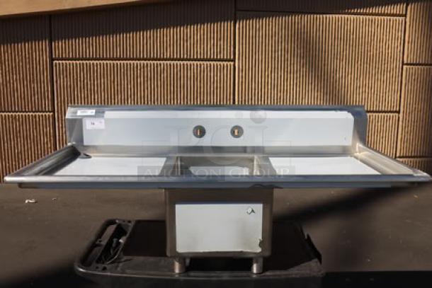 Regency stainless steel sink, model 600S11723224, 65" with one compartment and two drainboards; new, out of packaging.