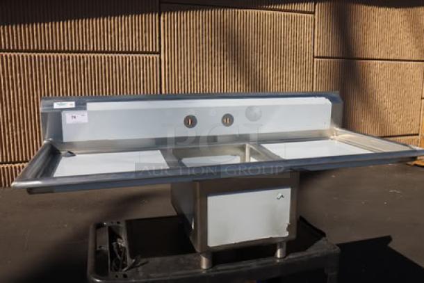 Regency 65" stainless steel commercial sink, model 600S11723224, brand new, with 2 drainboards, 17"x23"x12" bowl.