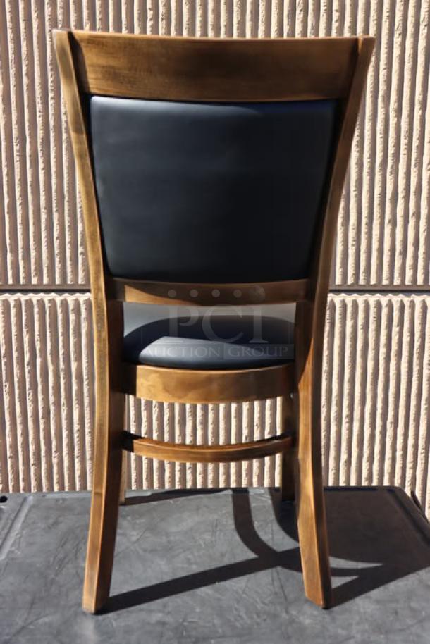 Lancaster Table & Seating Sofia chair with vintage finish wood, black vinyl seat, and back. New, minor scratches, assembled.