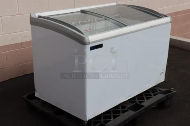 Brand new 2025 Master-Bilt MSC-49AA 49" curved top display freezer. Dented, needs new power cord, S/N: SD0043200112502270044.