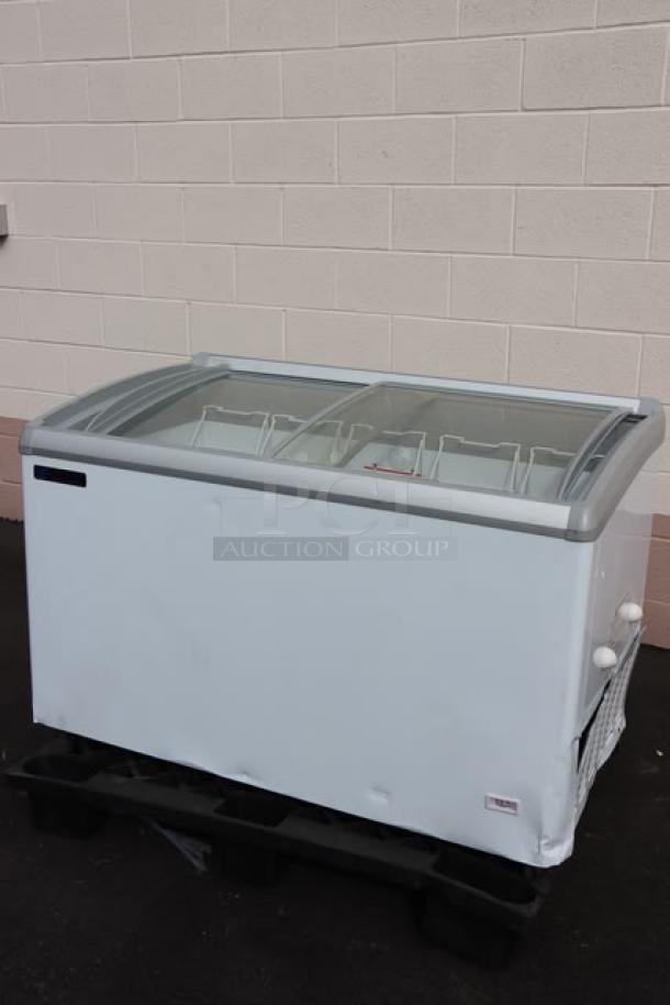 BRAND NEW Master-Bilt MSC-49AA 49" display freezer. Curved top, dented, needs power cord replacement, 115V, 1.5A, 1 phase.