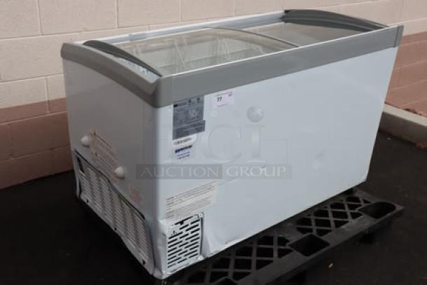 Master-Bilt MSC-49AA 49" curved top display freezer. New with dents; needs power cord replacement. Model MSC-49AA, S/N: SD0043200112502270044.