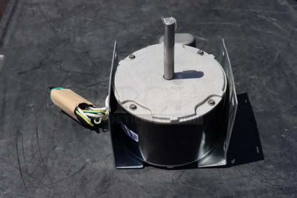 Brand new Manitowoc Ice 7629413 fan motor, 208-230V, slight bend in mounting bracket, wires intact.