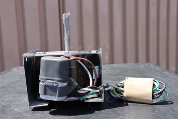 BRAND NEW Manitowoc Ice 7629413 fan motor, 208-230v. Slight bend in mounting bracket, wires intact.