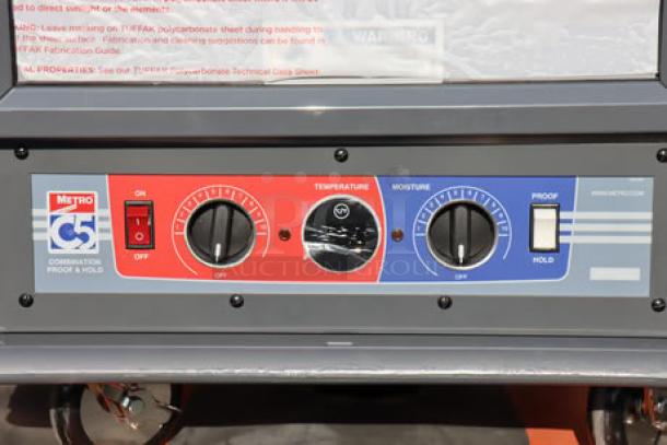 Brand new Metro C519-CFC-4 holding/proofing cabinet controls, featuring temperature and moisture dials.