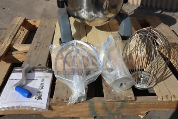 Vollrath 40757 20 Qt. planetary stand mixer, new with scratches, includes guard, whisk, paddle, dough hook, on wooden pallet.