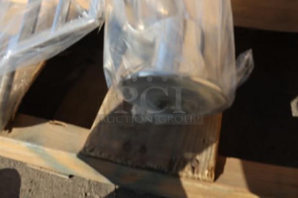 Vollrath 40757 20 Qt. Planetary Stand Mixer in packaging, new condition with visible standard accessories.