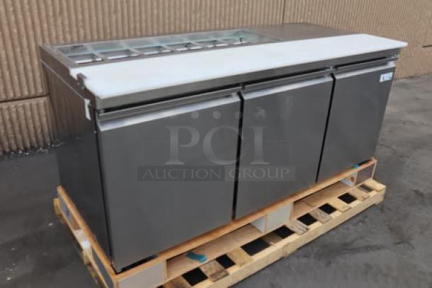 Avantco SS-PT-71-12-HC 70" 3-door stainless steel refrigerated sandwich prep table, new, with workstation, on a pallet.