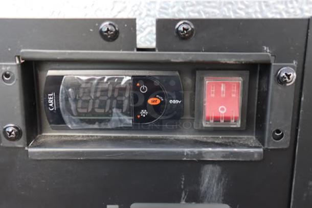 Digital control panel of Avantco SS-PT-71-12-HC refrigerated prep table with Carel interface showing temperature settings.