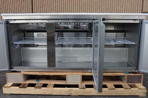 Avantco SS-PT-71-12-HC 70" 3-door stainless steel refrigerated sandwich prep table on pallet; doors open.