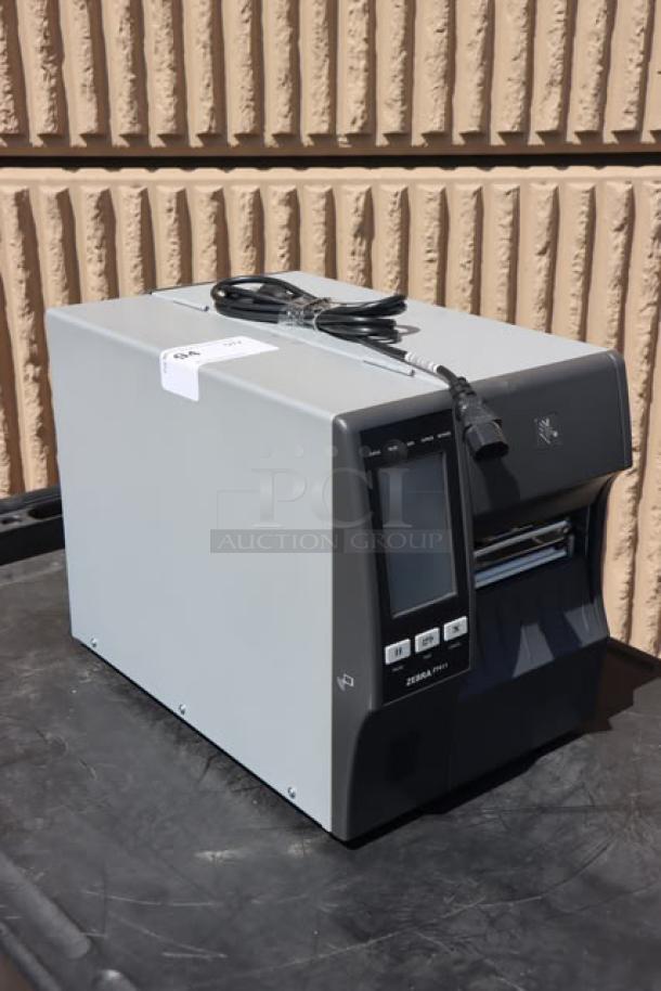 Zebra ZT411 Industrial Barcode Printer, Model ZT41142-T410000Z, in good condition. Includes power cable. S/N: 99J242802106.