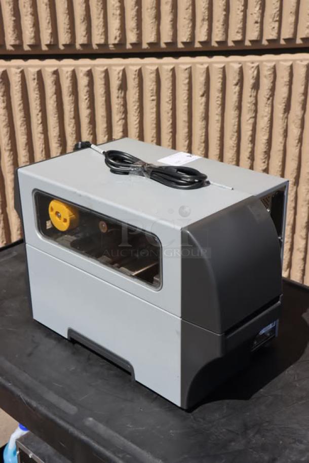 Zebra ZT411 Industrial Barcode Printer, model ZT41142-T410000Z, with cord. Visible serial number: 99J242802106.