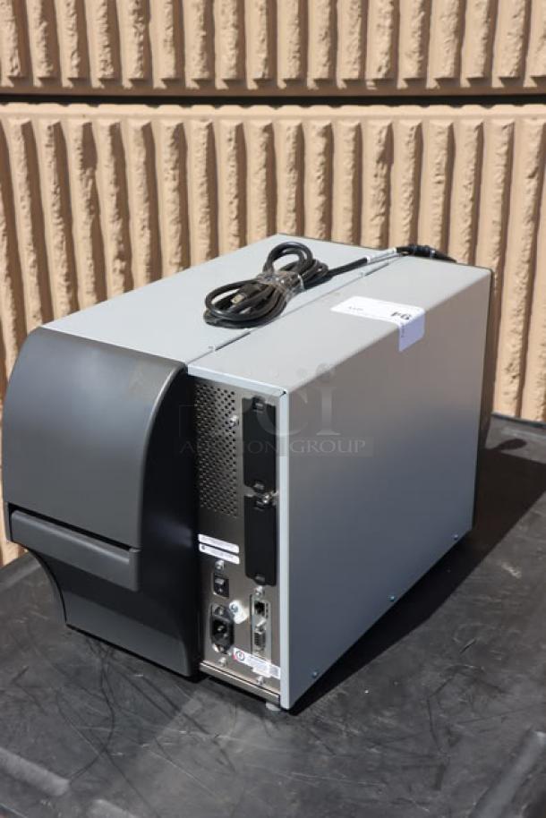Zebra ZT411 industrial barcode printer, model ZT41142-T410000Z, shown in good condition with visible power cable.