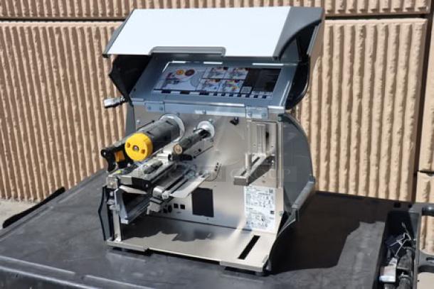 Zebra ZT411 Industrial Barcode Printer, Model ZT41142-T410000Z, open view, showcasing internal components. Serial No. 99J242802106.