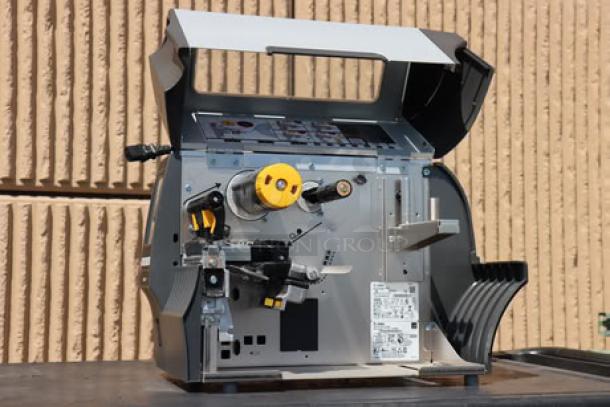 Zebra ZT411 industrial barcode printer model ZT41142-T410000Z, open view showing internal components. S/N: 99J242802106.