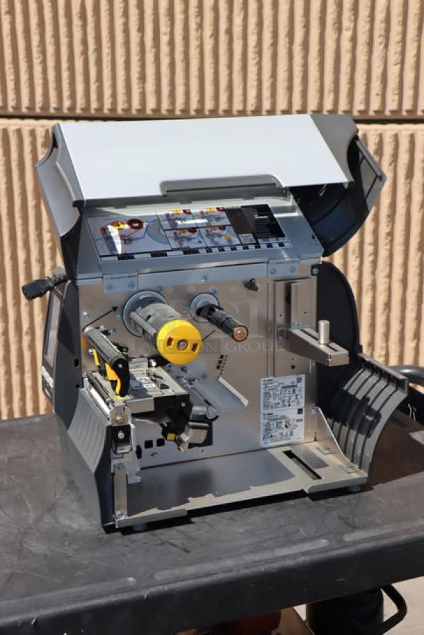 Zebra ZT411 Industrial Barcode Printer, model ZT41142-T410000Z, open view showing internal components and labels.