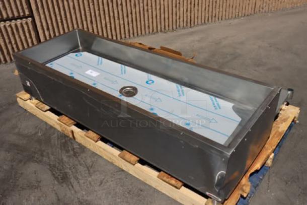 Brand new Eagle Group PCP-4 mobile ice-cooled cold food table, unassembled, with galvanized undershelf, minor scratches visible.