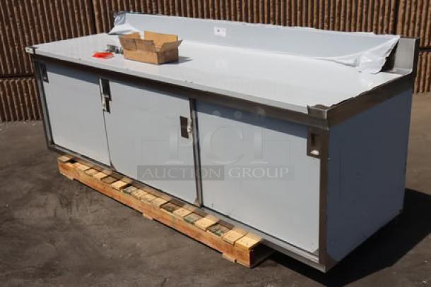 Regency 600EBTB3096D stainless steel table, 30"x96", with sliding doors, adjustable midshelf, and 6" backsplash. Brand new.