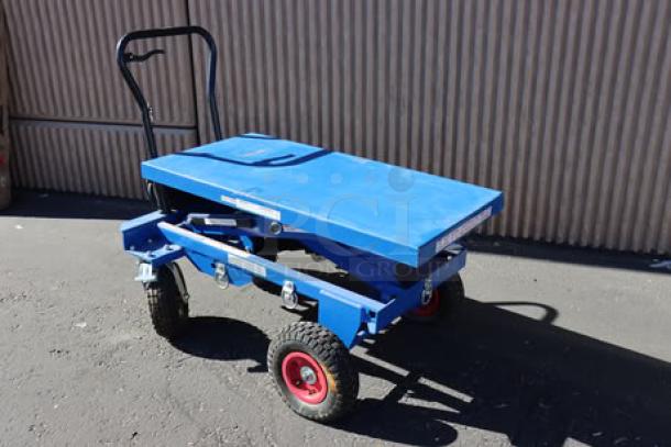 Brand new Vestil hydraulic cart, 40"x20.5", blue, dented top, wheels seized, 1,500 lb capacity, CART-PN-1500, S/N: S2630836-1.
