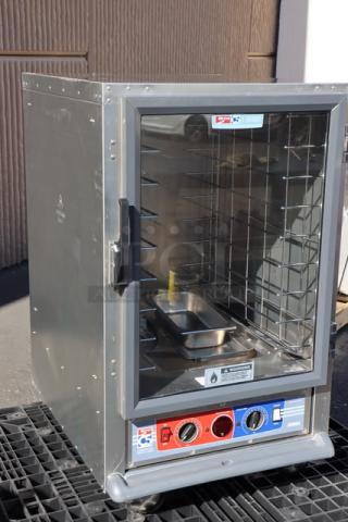 Brand new Metro C515-CFC-4 half-size uninsulated cabinet with clear door, 120V, 2000W, scratch-and-dent condition.