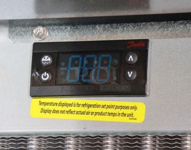 Brand new Delfield N227P 12-gallon drop-in freezer display panel, temperature settings shown, warning label present.