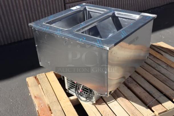 Brand new Delfield N227P 12-gallon drop-in freezer with stainless steel lids, minor dent on right side panel, 115V, 2.9A.