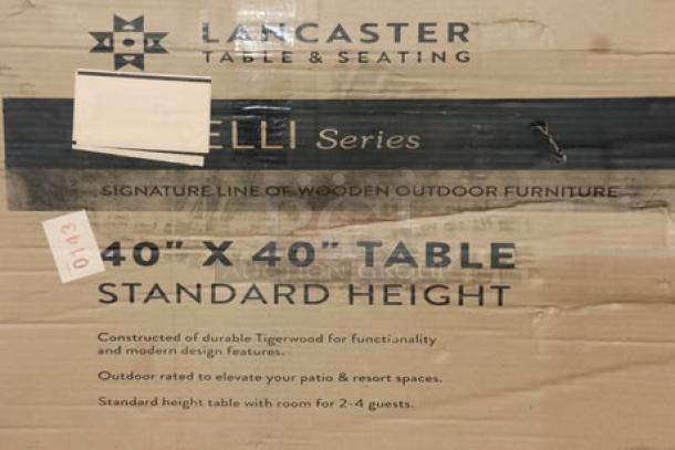 Brand new Lancaster Virelli 40" x 40" tigerwood outdoor table. Packaging is damaged; ideal for patios and resorts.