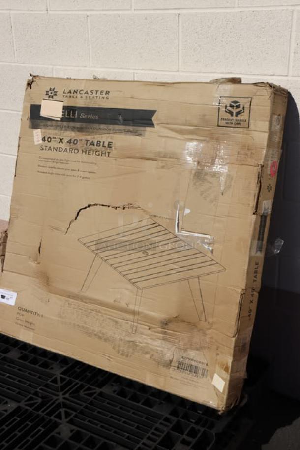 Brand new Lancaster Virelli 40"x40" Tigerwood outdoor table, damaged packaging, model 427VR4040TB, standard height.
