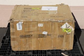 Regency 600GT25 50 lb. 25 GPM grease trap, non-threaded connections, box damaged, tags show model and shipping details.
