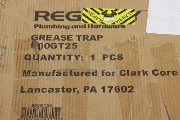 Regency 600GT25 grease trap packaging with visible scratches and tears, labeled for Clark Core, Lancaster, PA.