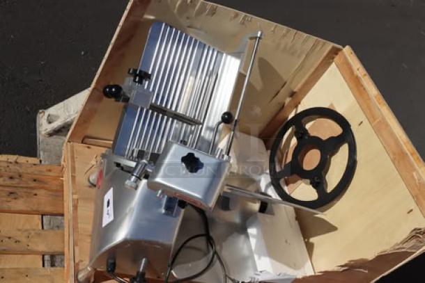 Avantco SL713MAN 13" meat slicer, medium-duty, manual gravity feed, 3/4 hp. New with damaged blade guard bracket. Working order.